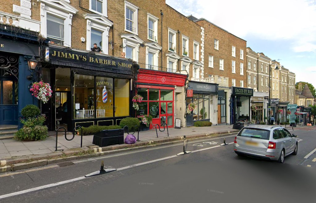 Looking along Haverstock Hill past Jimmy's Barber Shop