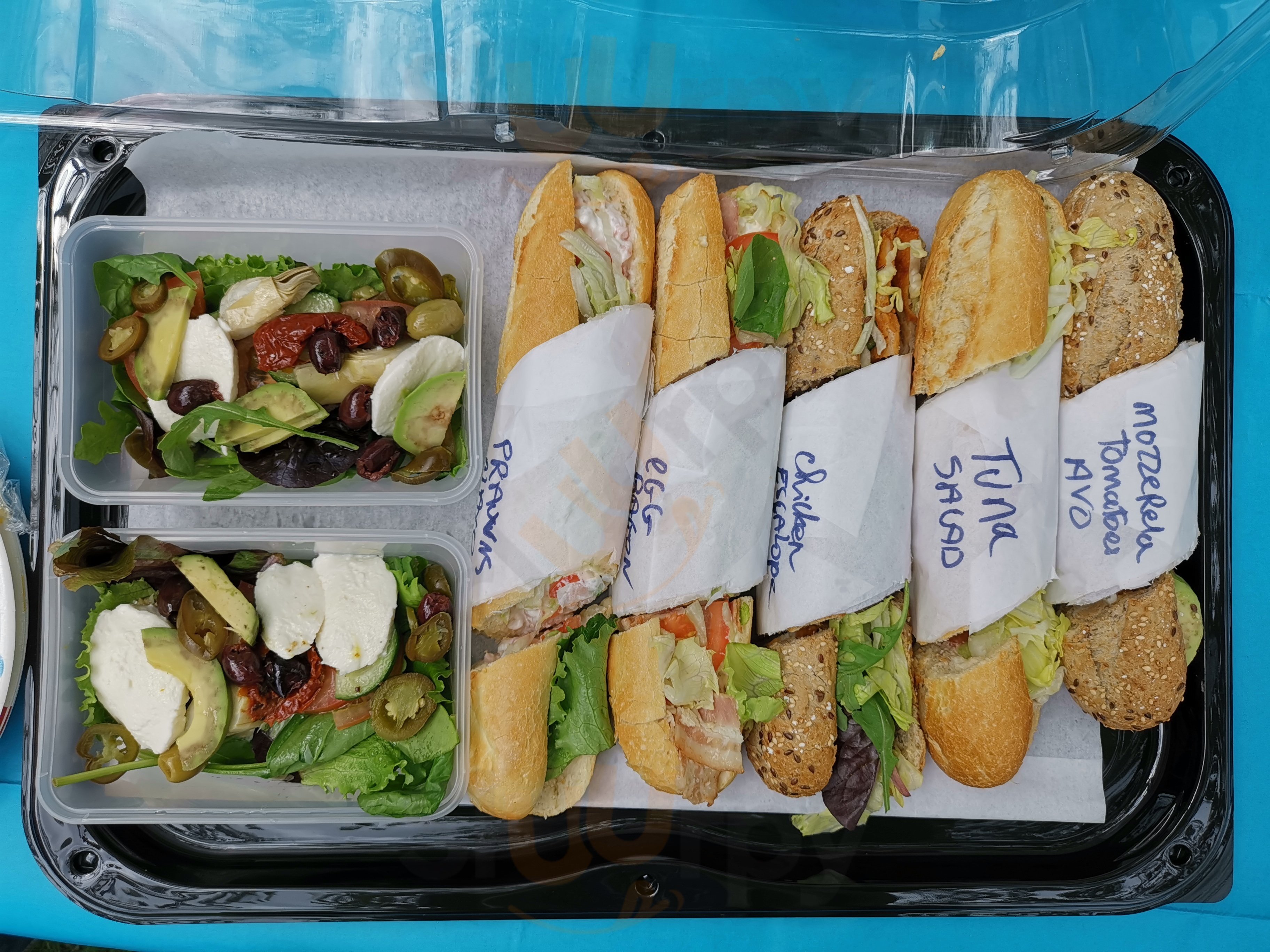 Platter of labelled baguettes and Mediterranean salads from La Cigale