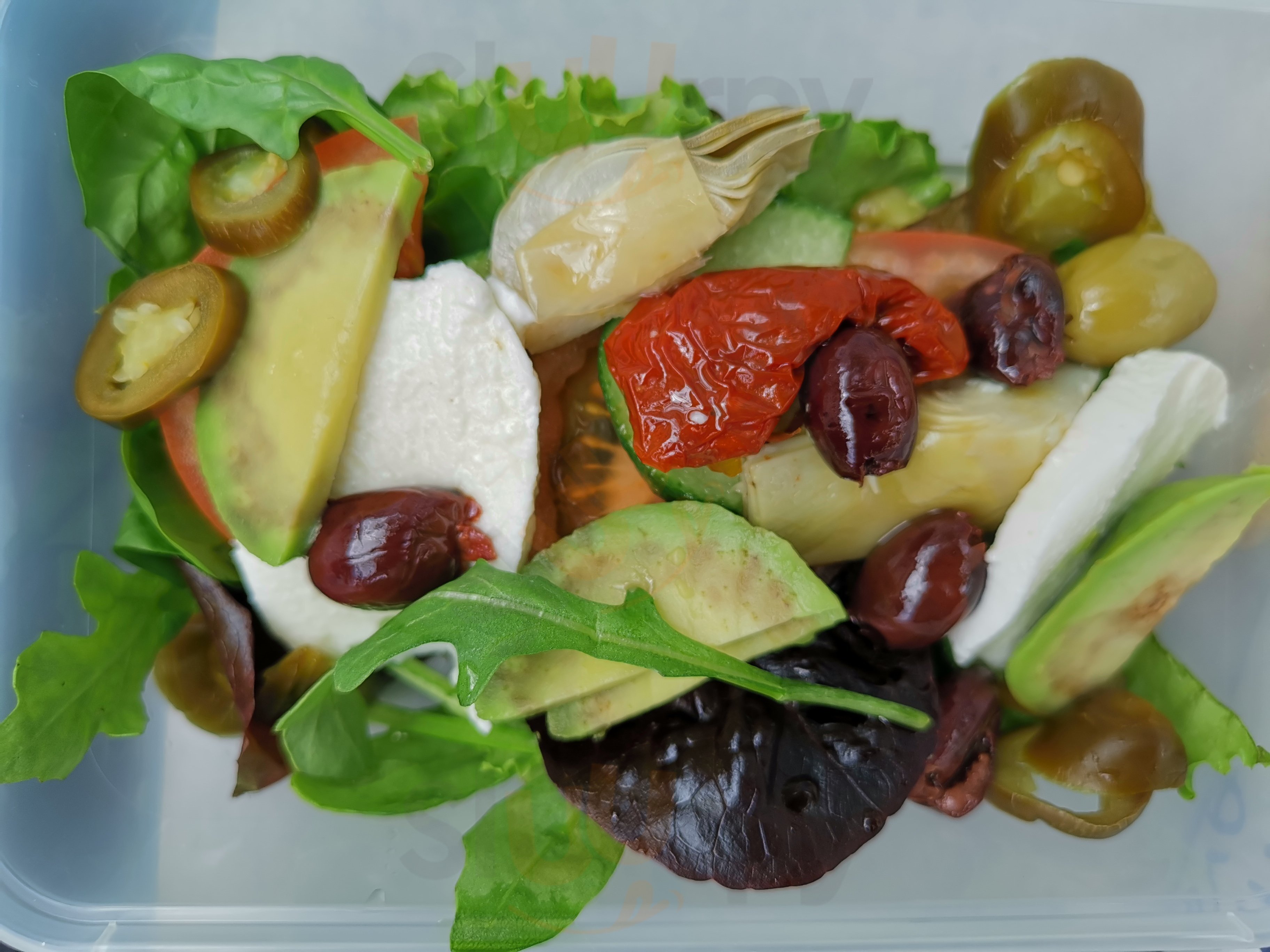 Fresh Mediterranean deli salad with mozzarella and olives from La Cigale
