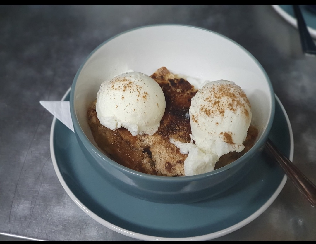 Warm apple crumble with vanilla ice cream